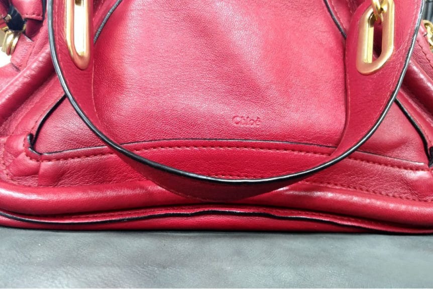 Example of peeling edge paint glazing on leather handbag handle