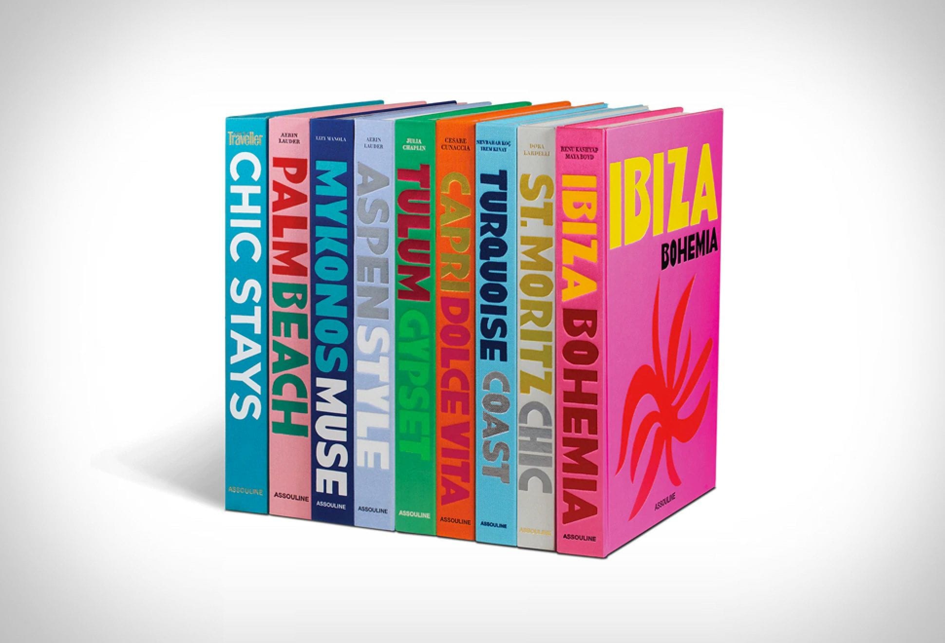 Assouline Travel Series books displayed with colorful spines showcasing the brand's signature design aesthetic