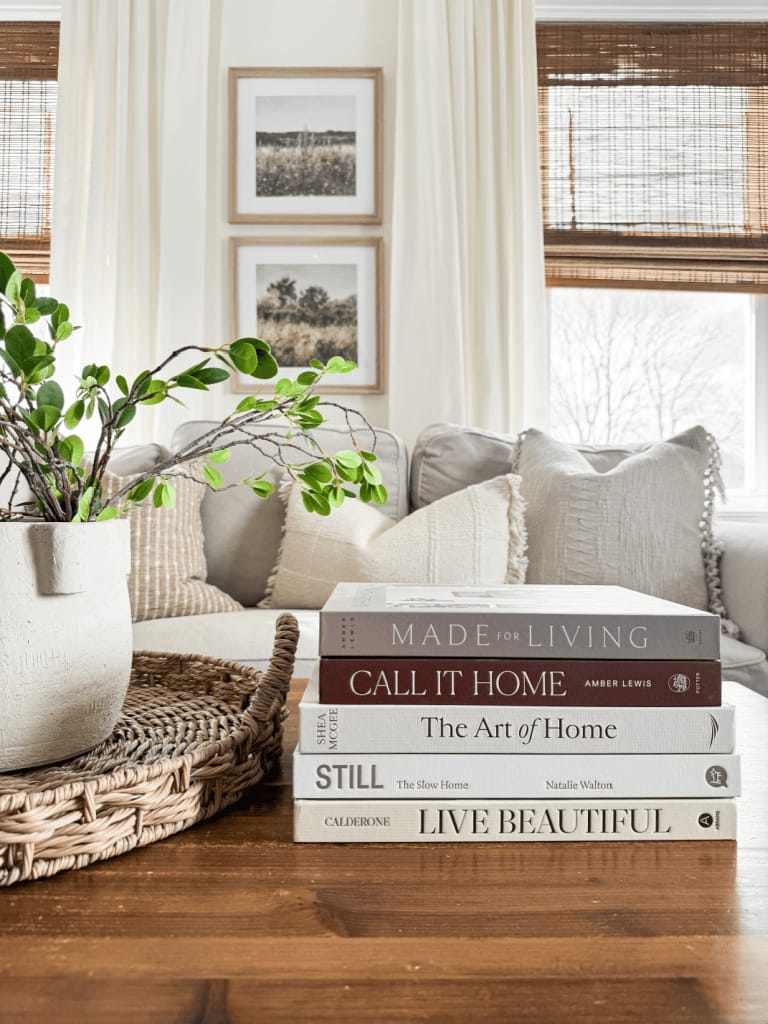 Decorating with coffee table books on a living room table as part of interior design styling