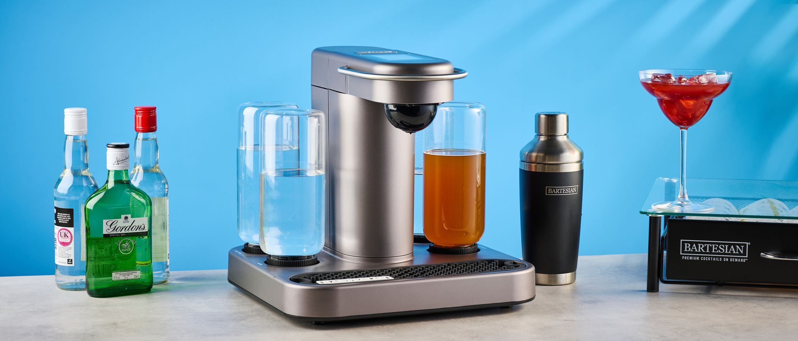Bartesian Premium Cocktail Machine on kitchen counter making a cocktail