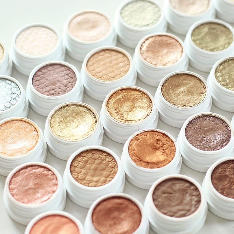ColourPop Super Shock Shadow collection showing various cream-to-powder eyeshadow shades with review swatches