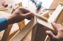 Flat pack furniture assembly with tools and hardware components