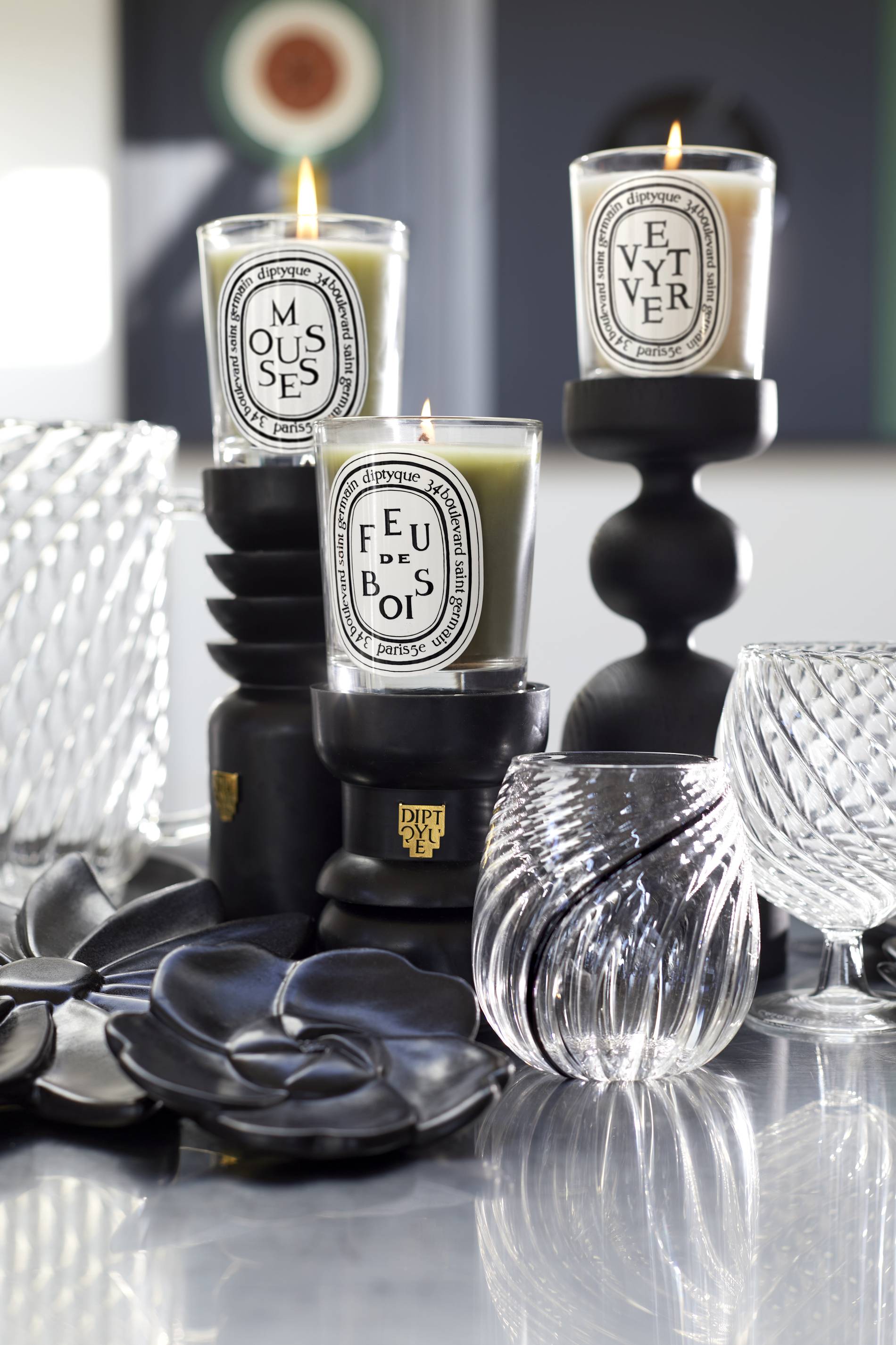 Diptyque luxury candle collection displayed in an elegant setting