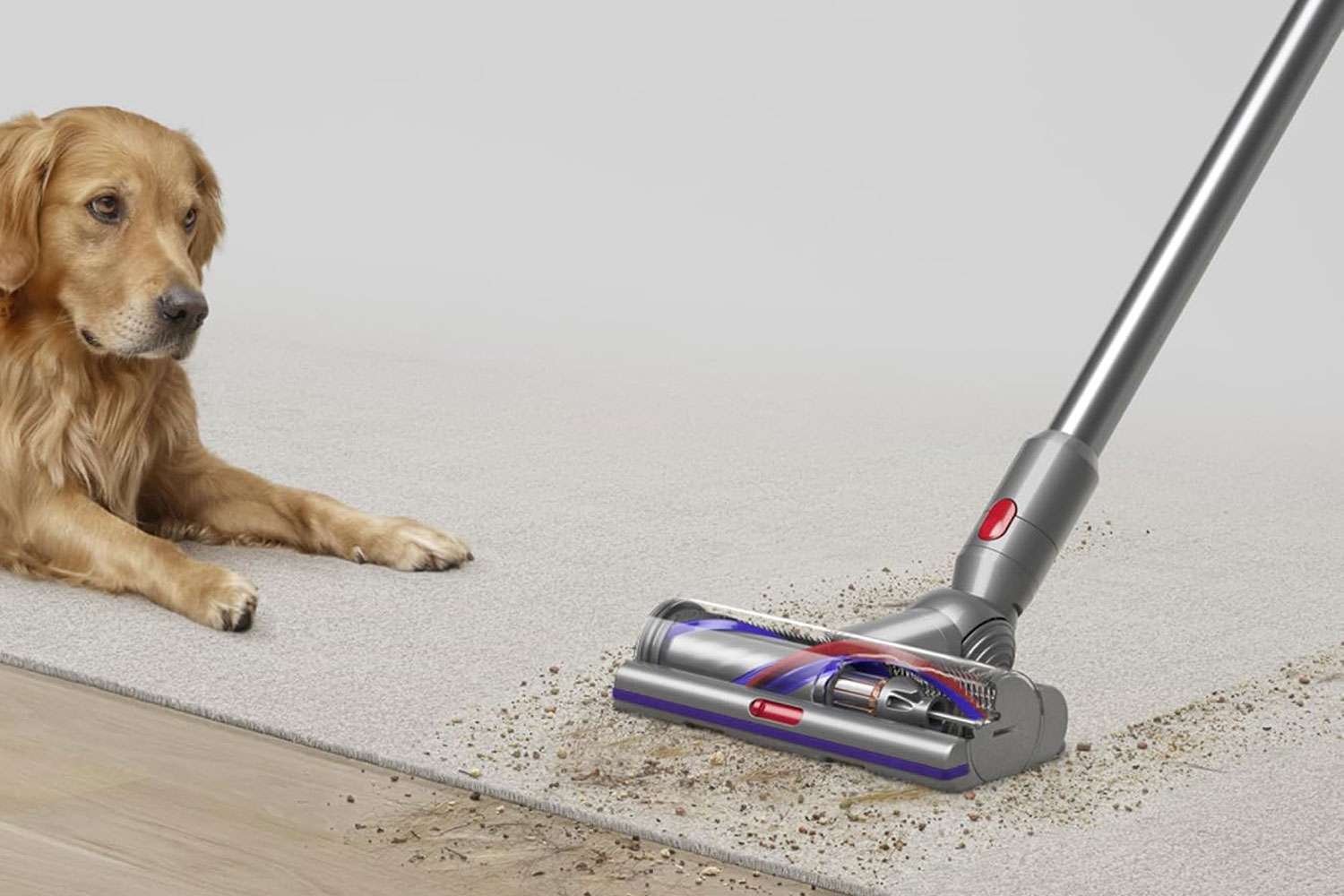 Dyson V15 Detect cordless vacuum cleaner in use on carpet showing laser dust detection