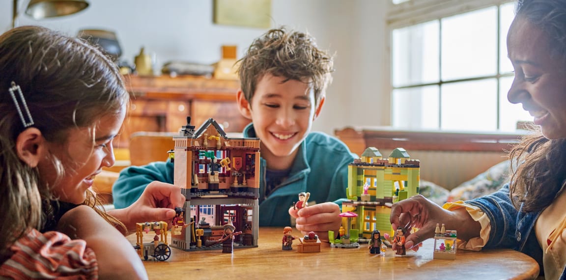 Family building LEGO sets together - educational bonding activity