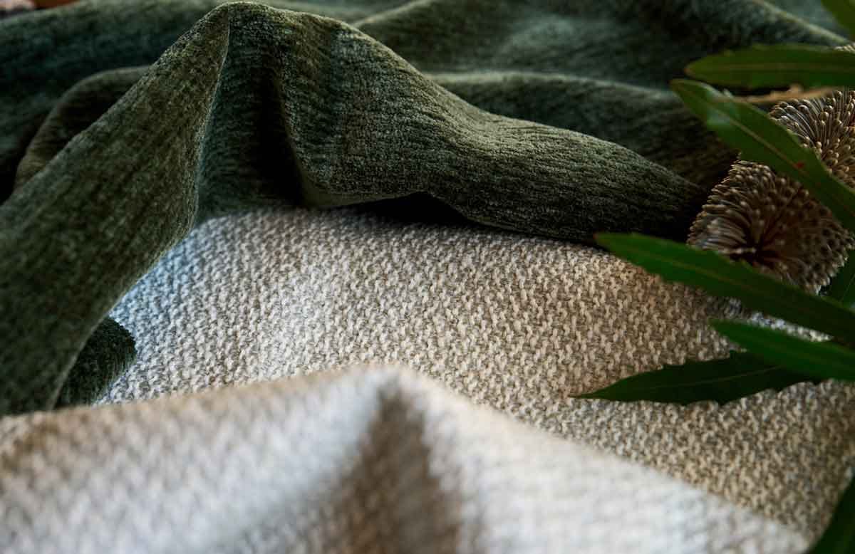 Detailed view of fabric pilling showing how fibers clump and create rough surface texture