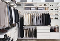 Avera custom closet system from The Container Store featuring a luxurious built-in look with integrated lighting