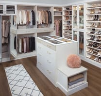 Preston walk-in closet system from The Container Store with island, showing high-end cabinetry finish