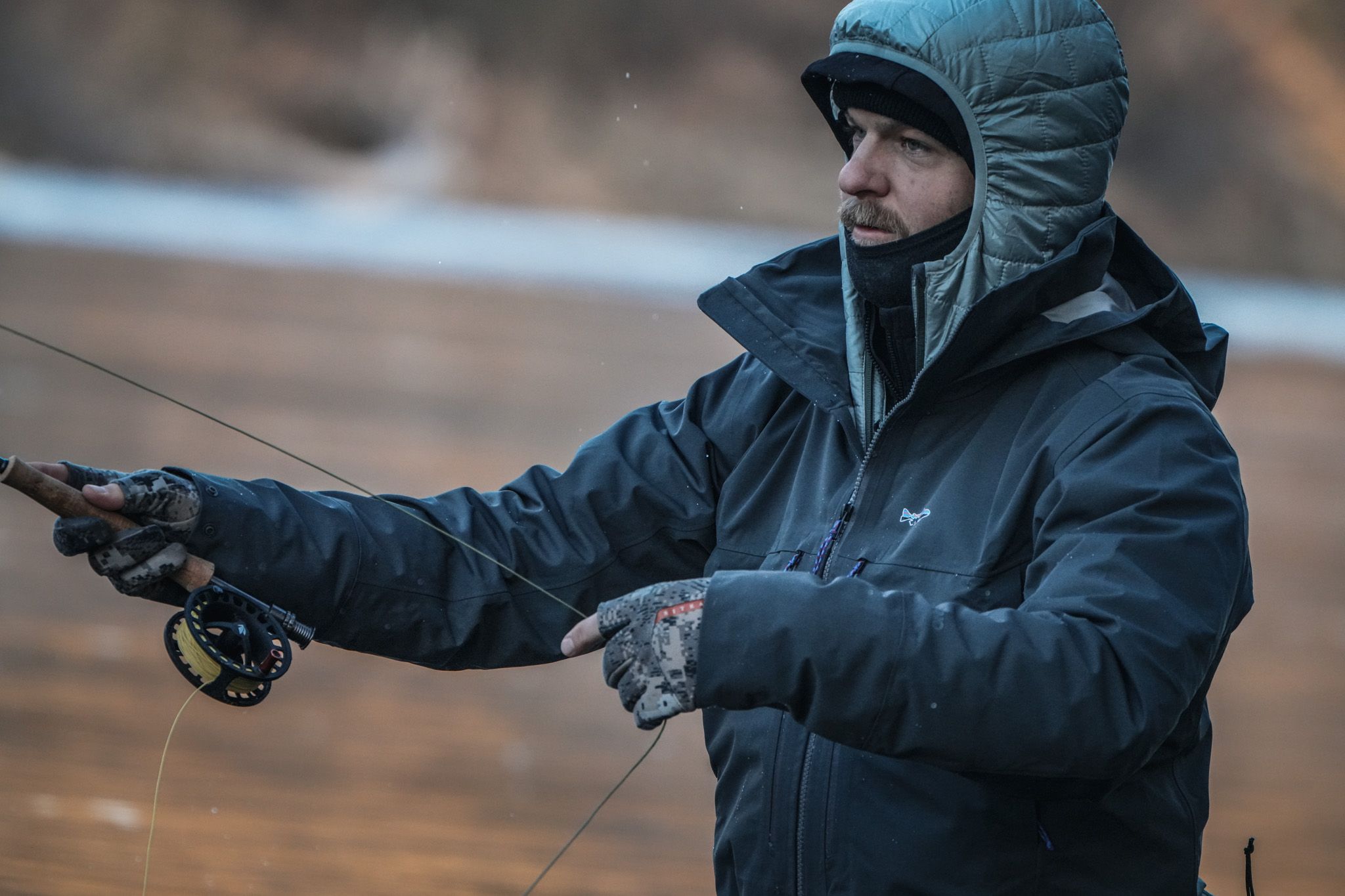 Fly fishing winter apparel gear including wading jackets and performance outerwear from Patagonia