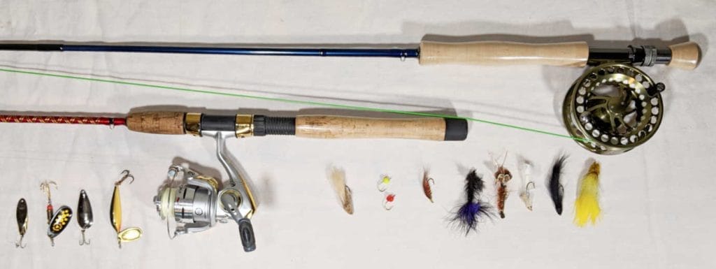 Fly fishing gear comparison showing various rods and reels side by side