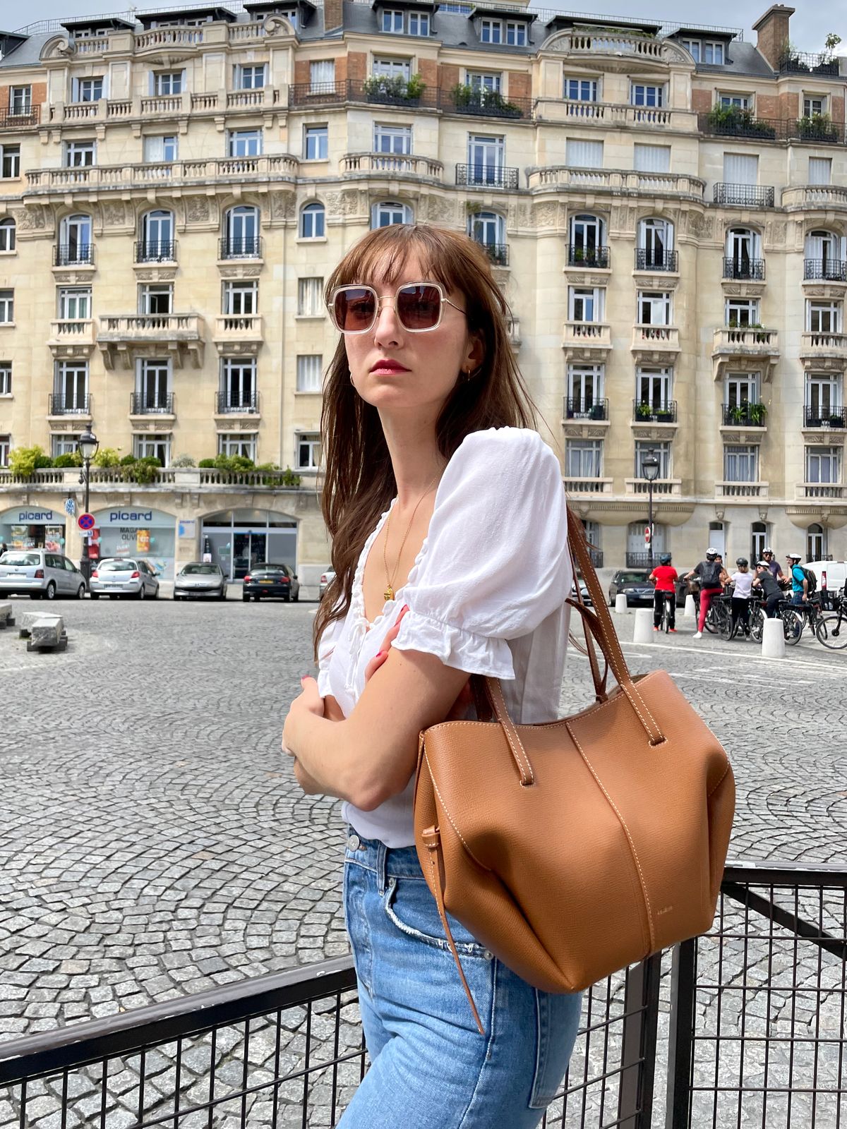 Polène Numéro Douze Cyme handbag in beige leather with signature sculptural design and rounded silhouette