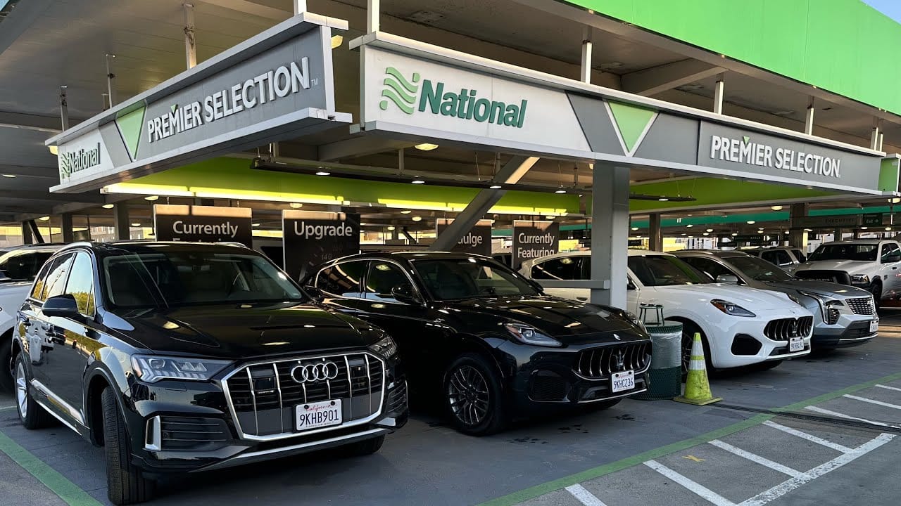 National Car Rental Emerald Aisle airport selection area showing rental vehicles lineup