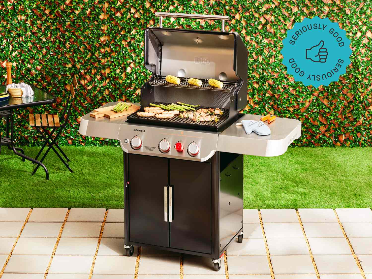 Weber Genesis E-325s three-burner propane gas grill with sear zone on outdoor patio
