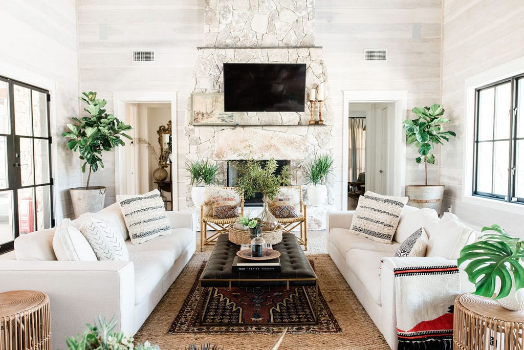 Modern farmhouse living room with neutral palette, rustic wood, and curated decor pieces showcasing The Nested Fig style