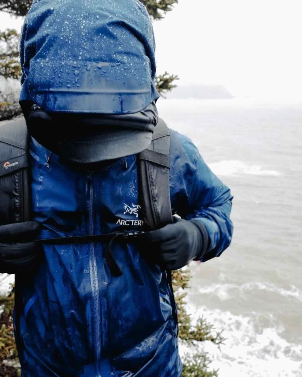 Waterproof jacket wetting out demonstration showing DWR coating failure causing water absorption on fabric surface