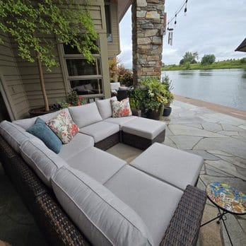 Tilly-Living Review 2026: An Investigation Into Price, Quality, and UK Consumer Rights -Yardbird outdoor furniture storefront showing aluminum-framed patio sets in showroom-couponsscout.com