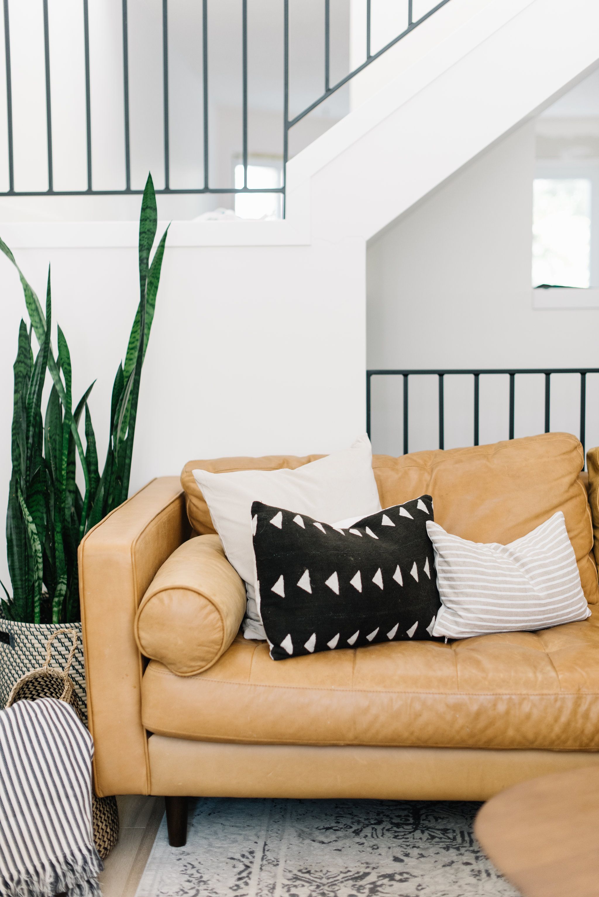 Article Sven leather sofa mid-century modern design in family living room setting