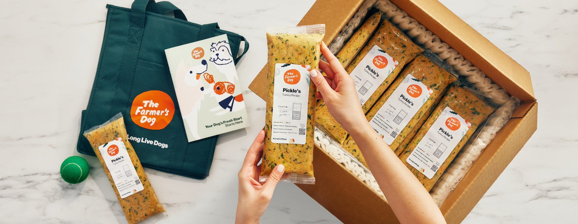 The Farmer's Dog fresh dog food meals in custom packaging with daily portions displayed