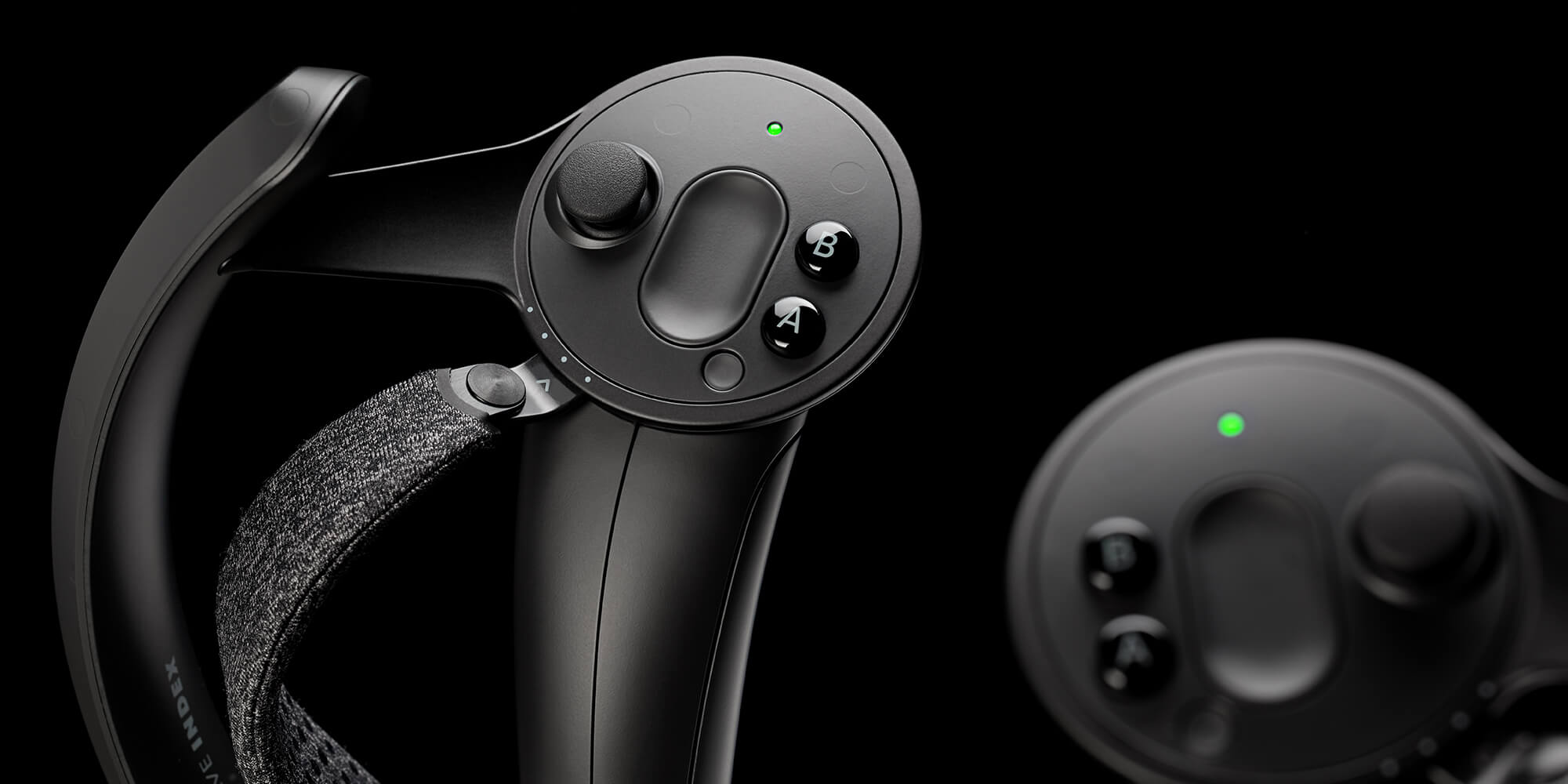 Valve Index Knuckle controllers showing finger tracking grip design for SteamVR