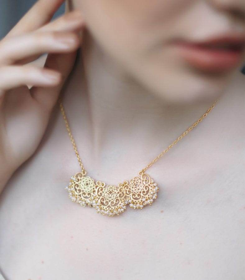 Zariin Indian demi-fine jewelry brand founders showcasing 22k gold plated brass collection