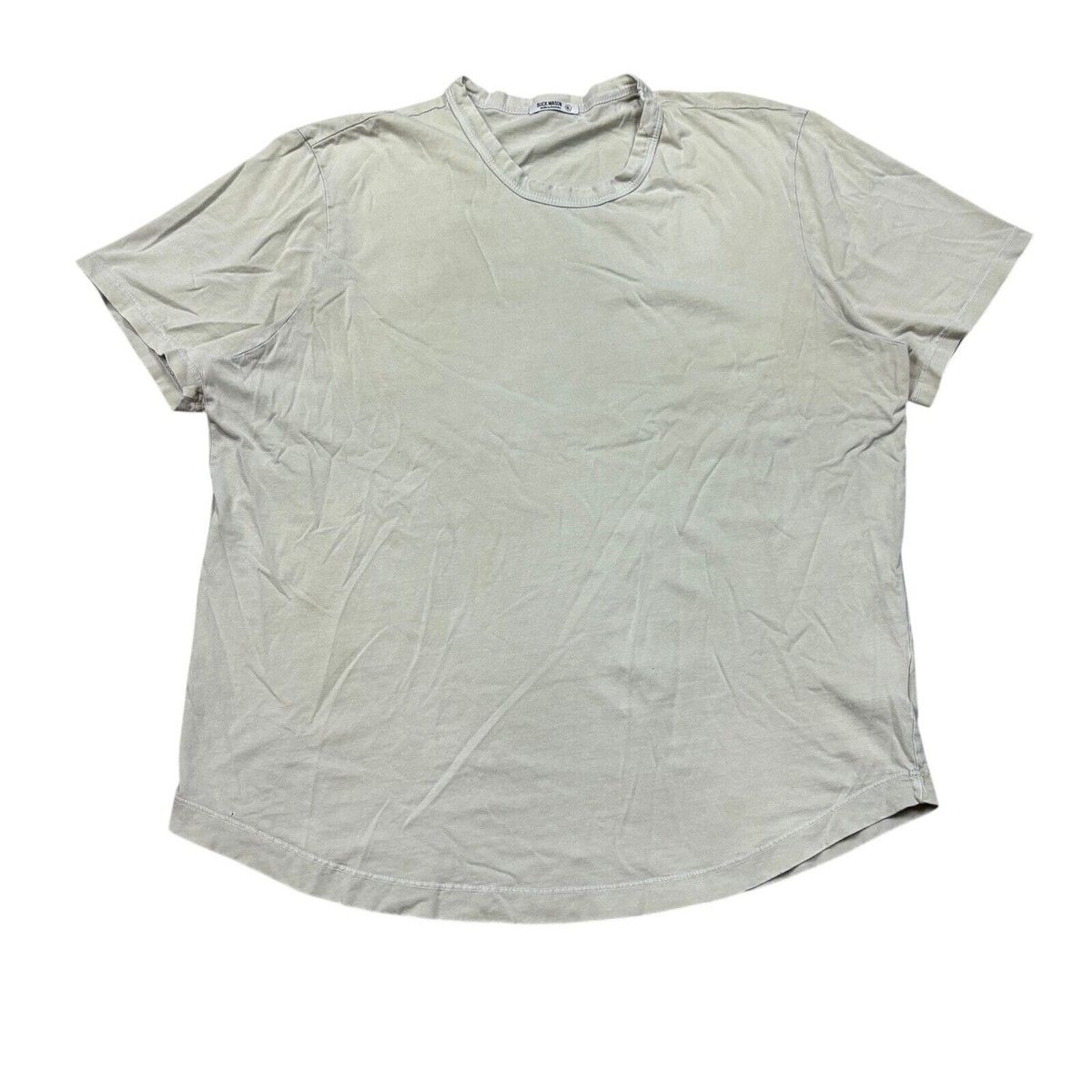 Buck Mason Slub Curved Hem Tee in heather grey showing textured slub cotton fabric and signature curved hemline
