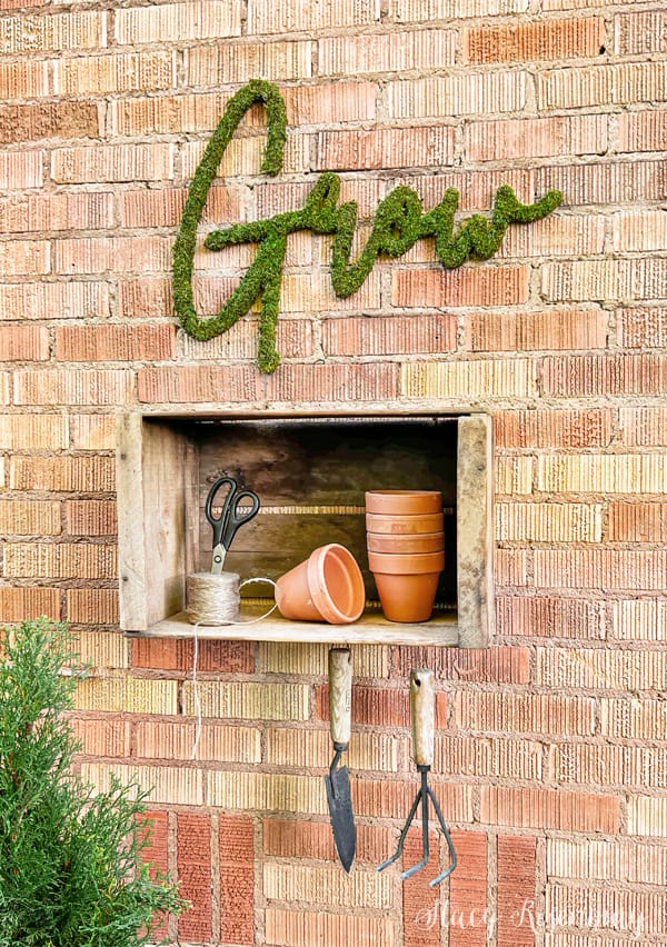 DIY moss wall art canvas craft project showing handmade preserved moss arrangement on frame