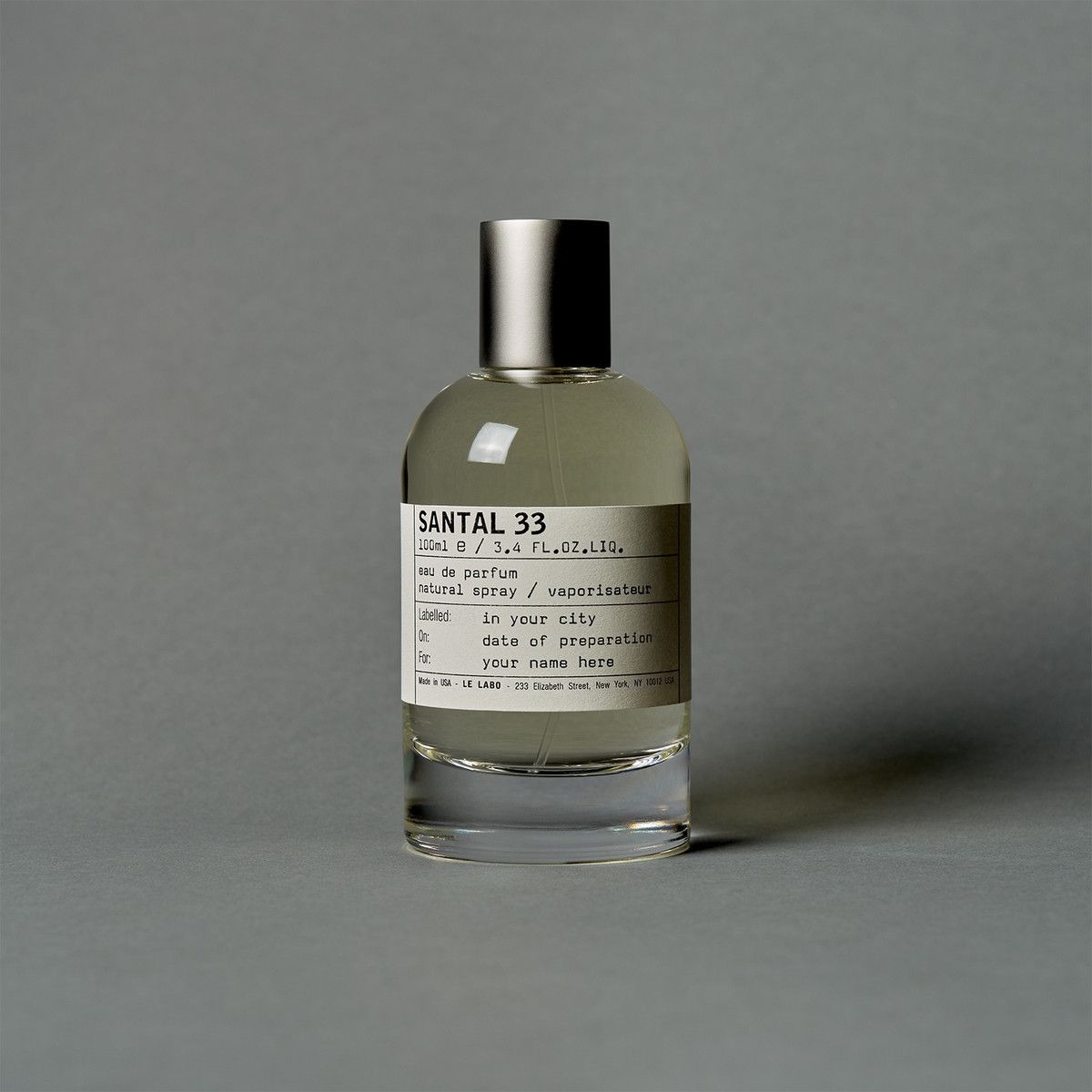 Le Labo Santal 33 artisanal perfume bottle with apothecary label and minimalist design