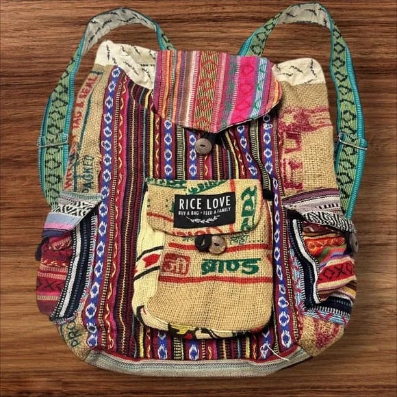Ricelove upcycled rice sack backpack in colorful boho festival style on display