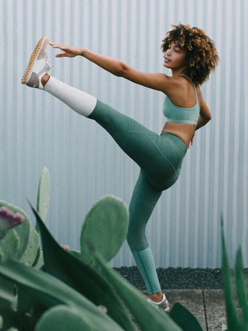 Minimalist activewear workout clothing collection laid out for women's gym wardrobe planning