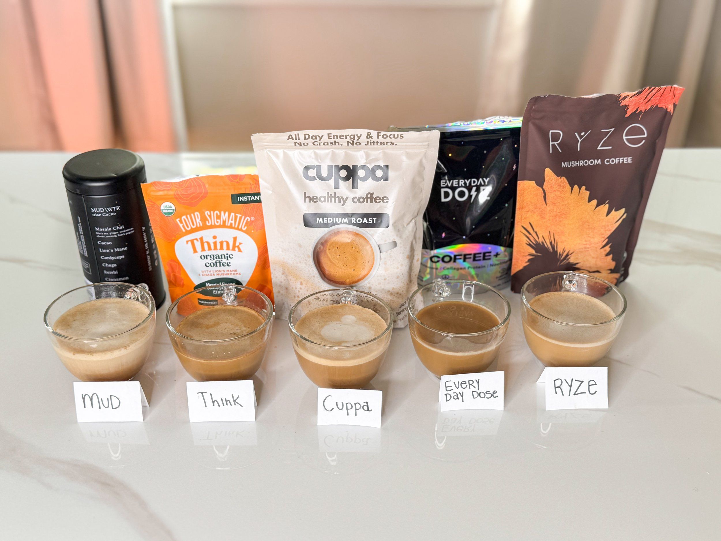 Functional mushroom coffee comparison featuring Ryze Four Sigmatic and MUD WTR brands