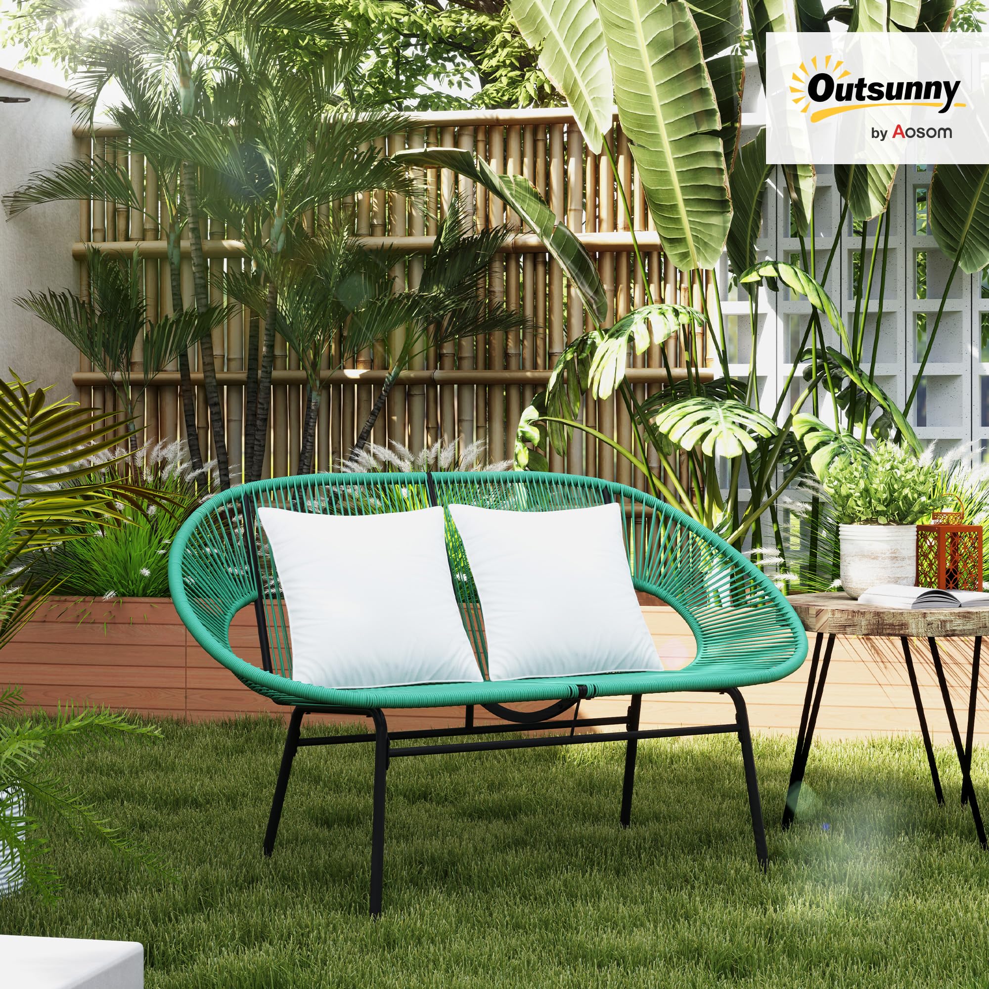 Outsunny green rattan garden sofa with cushions and steel frame set up on outdoor patio