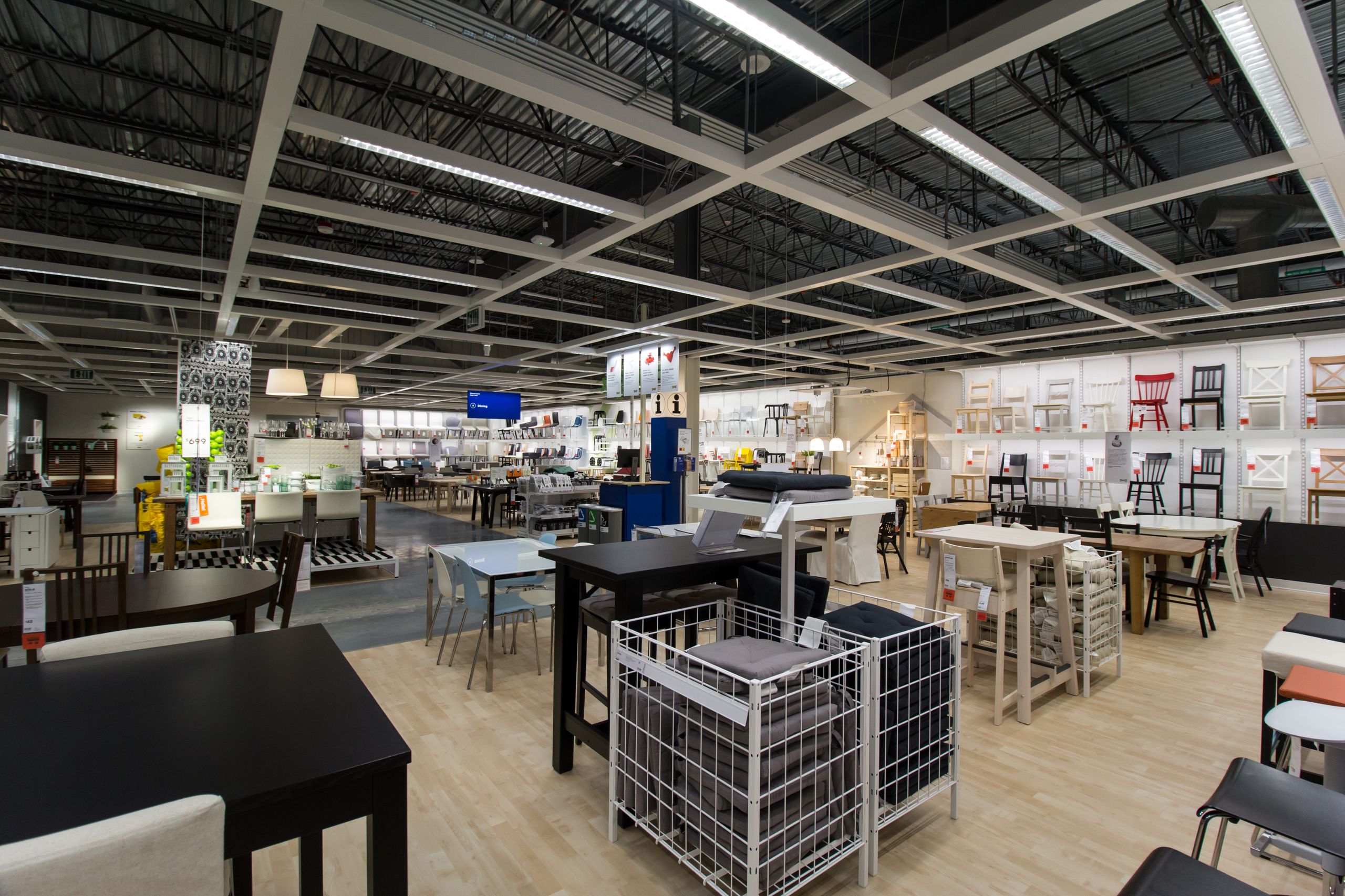 IKEA home showroom displaying flat-pack furniture arranged in a modern lifestyle setting
