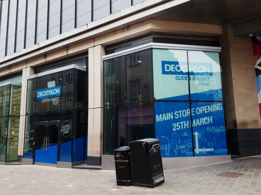 Retail click and collect pickup point at a UK shopping centre showing in-store collection process