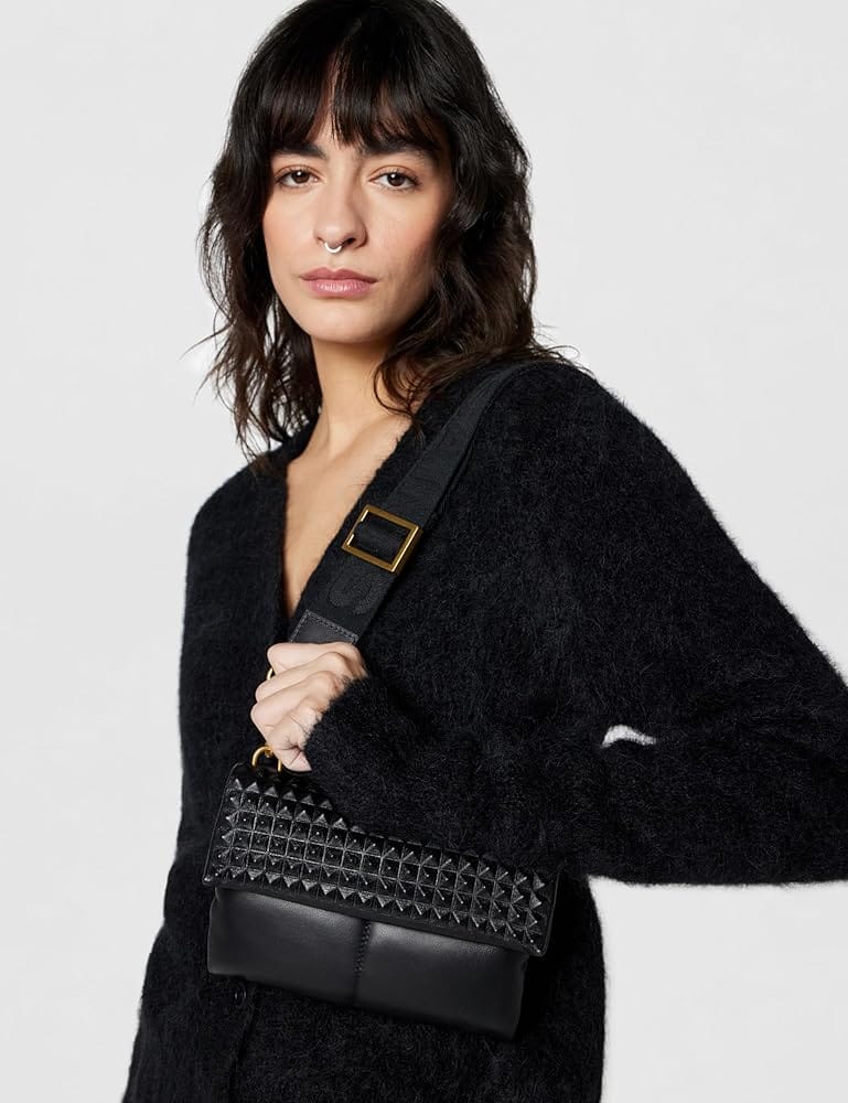 AllSaints Ezra stud crossbody bag showing durable heavy-plated hardware and industrial edge design
