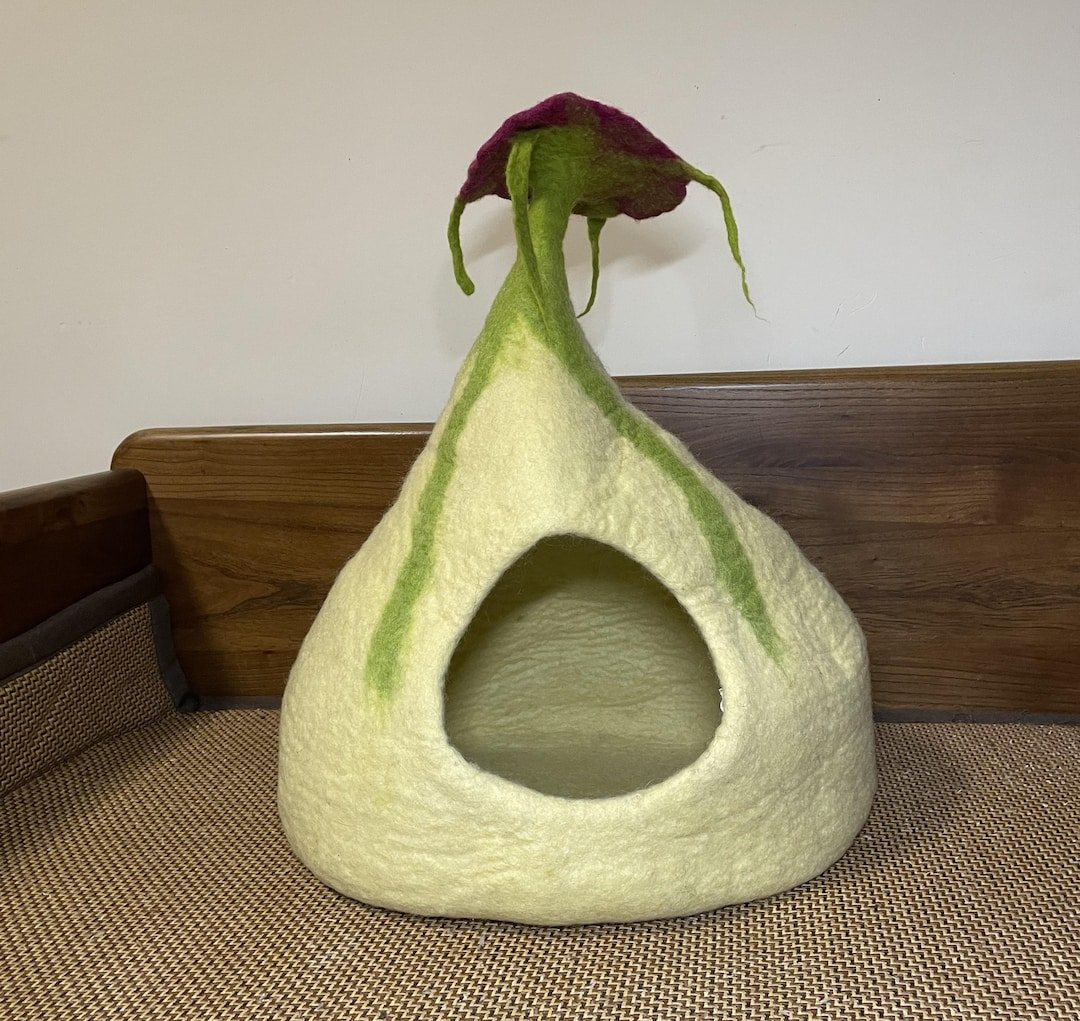Handmade wool cat cave from Nepal sold on Etsy showing unique artisan felted design