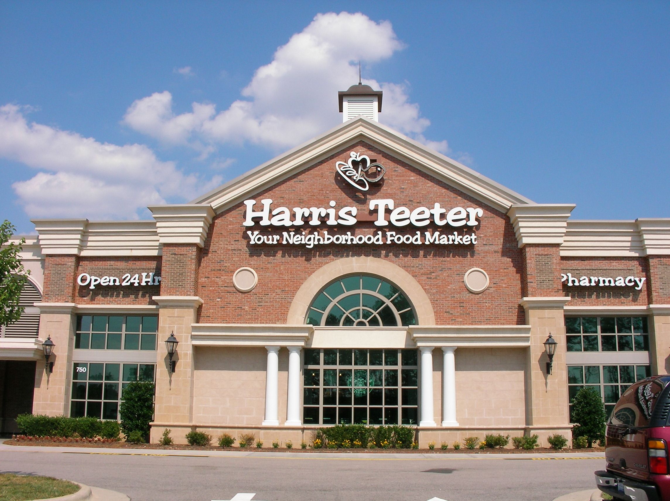 Harris Teeter grocery store exterior with modern signage showing premium supermarket branding