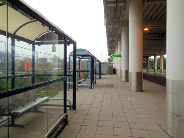 Bus stops and coach drop-off zones outside Gatwick Airport South Terminal entrance