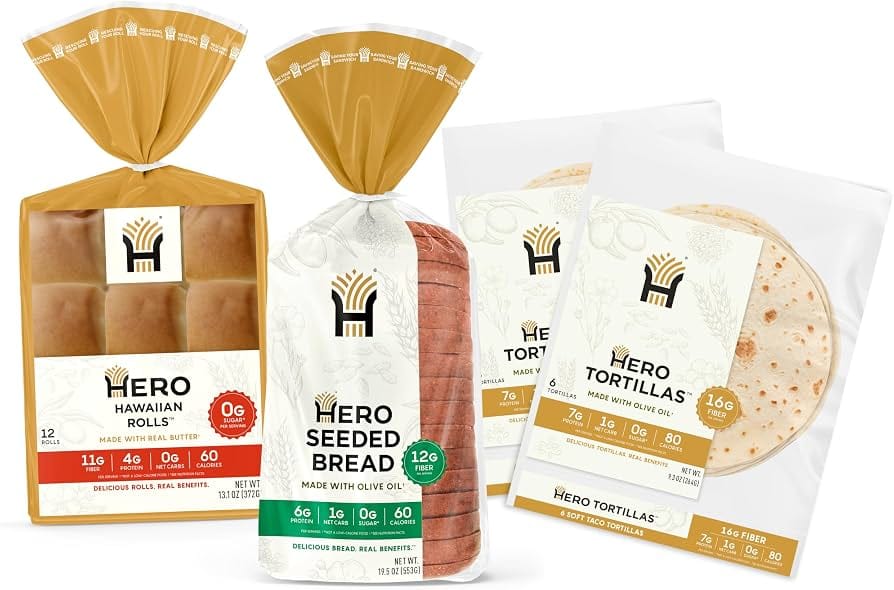 Hero Bread low carb keto loaves and buns lineup displayed on wood counter