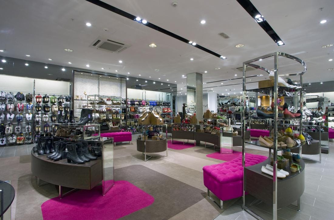 Next UK retail store interior showing clothing displays and womenswear section for family shopping
