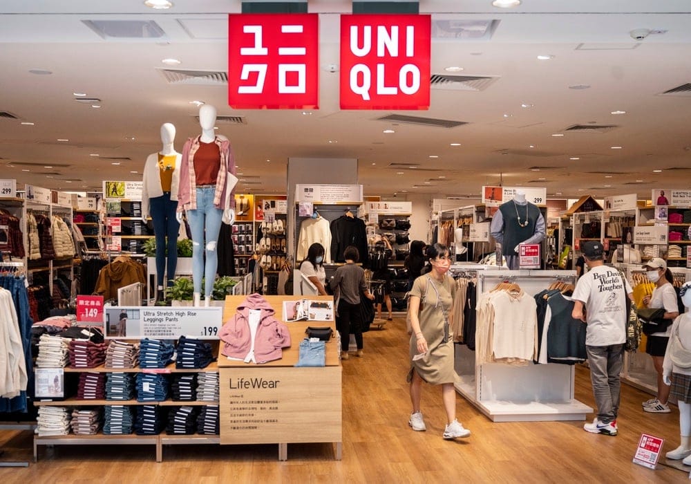 Uniqlo store front showing LifeWear philosophy branding and durable basics apparel display for shoppers
