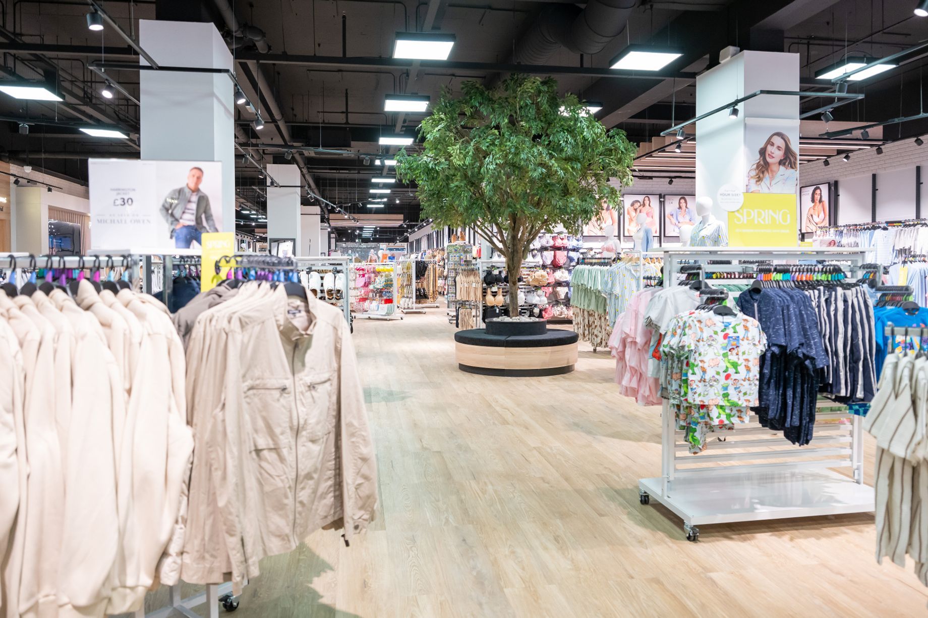 Peacocks UK high street clothing store interior with racks of budget womenswear on display