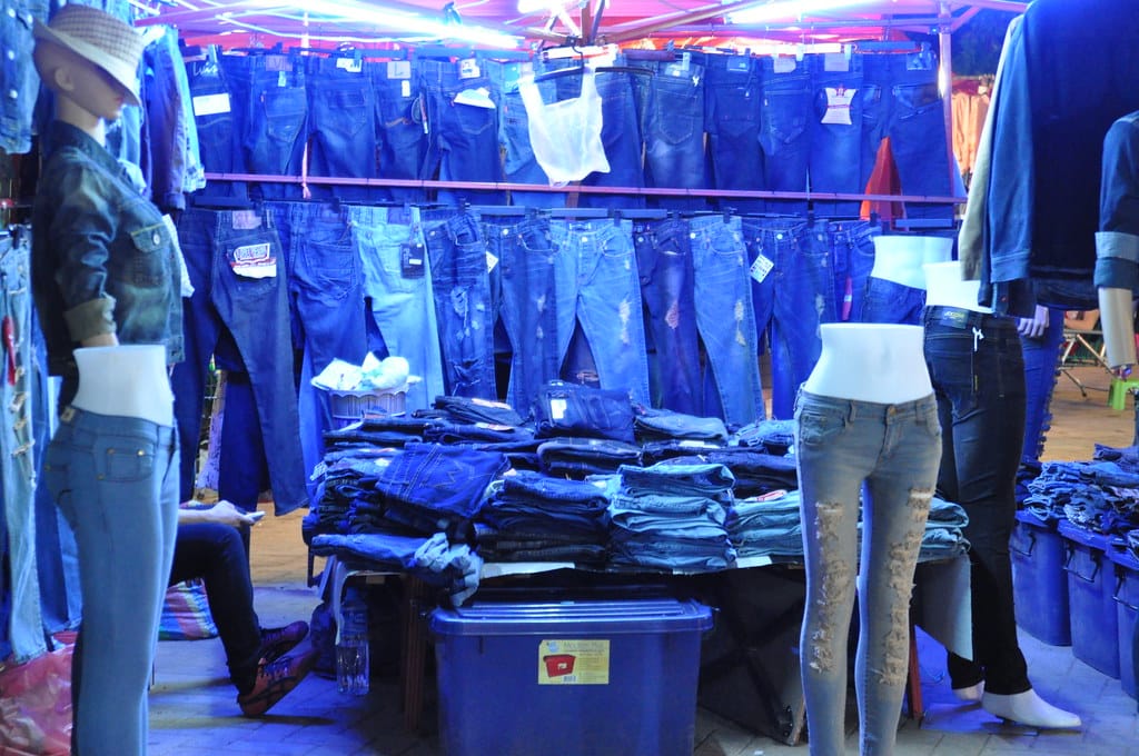 Rack of budget denim jeans in a UK high street fashion retailer illustrating Peacocks womenswear pricing