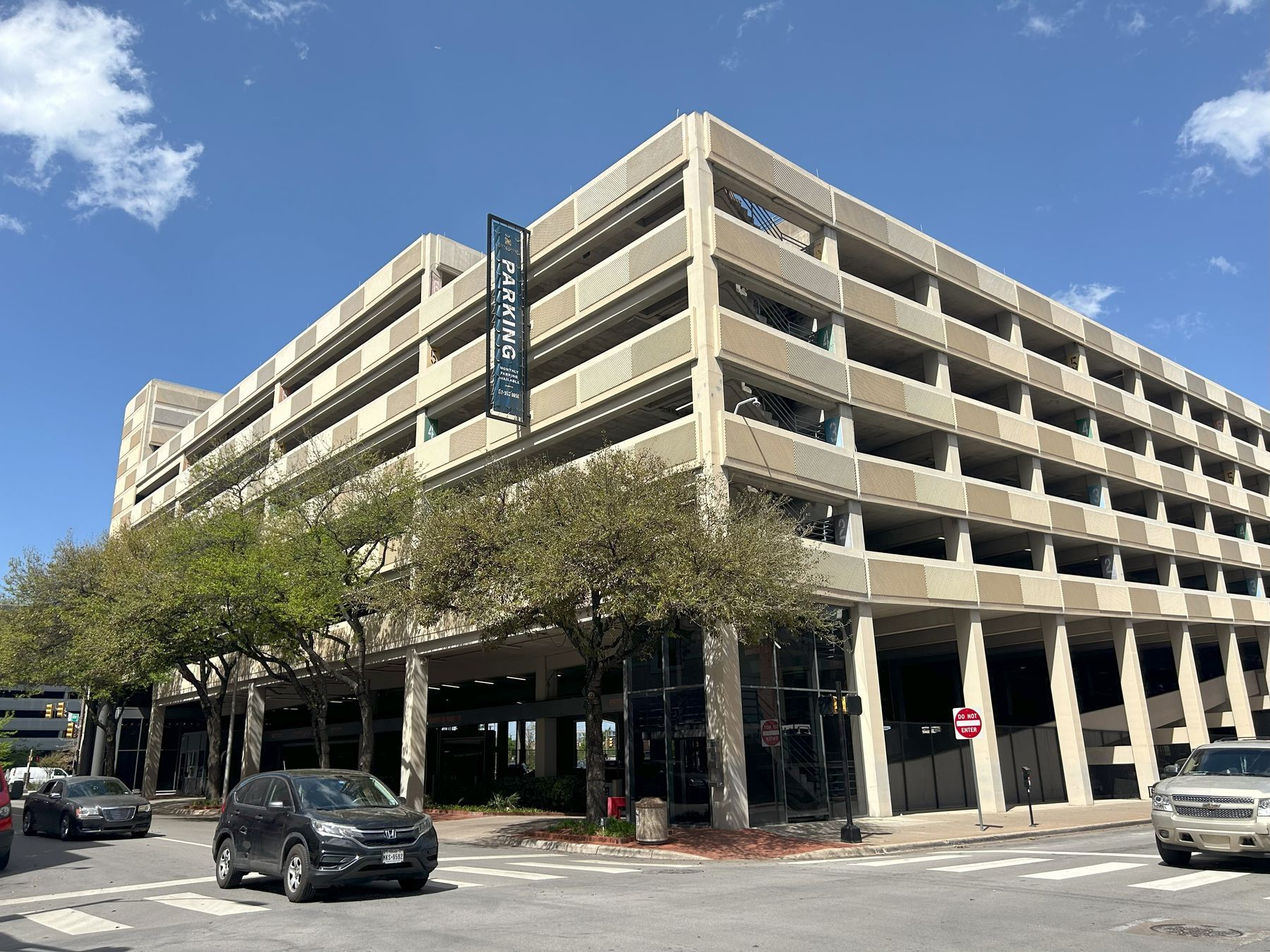 Downtown urban parking garage exterior showing multi-level concrete structure where SpotHero reservations are honored