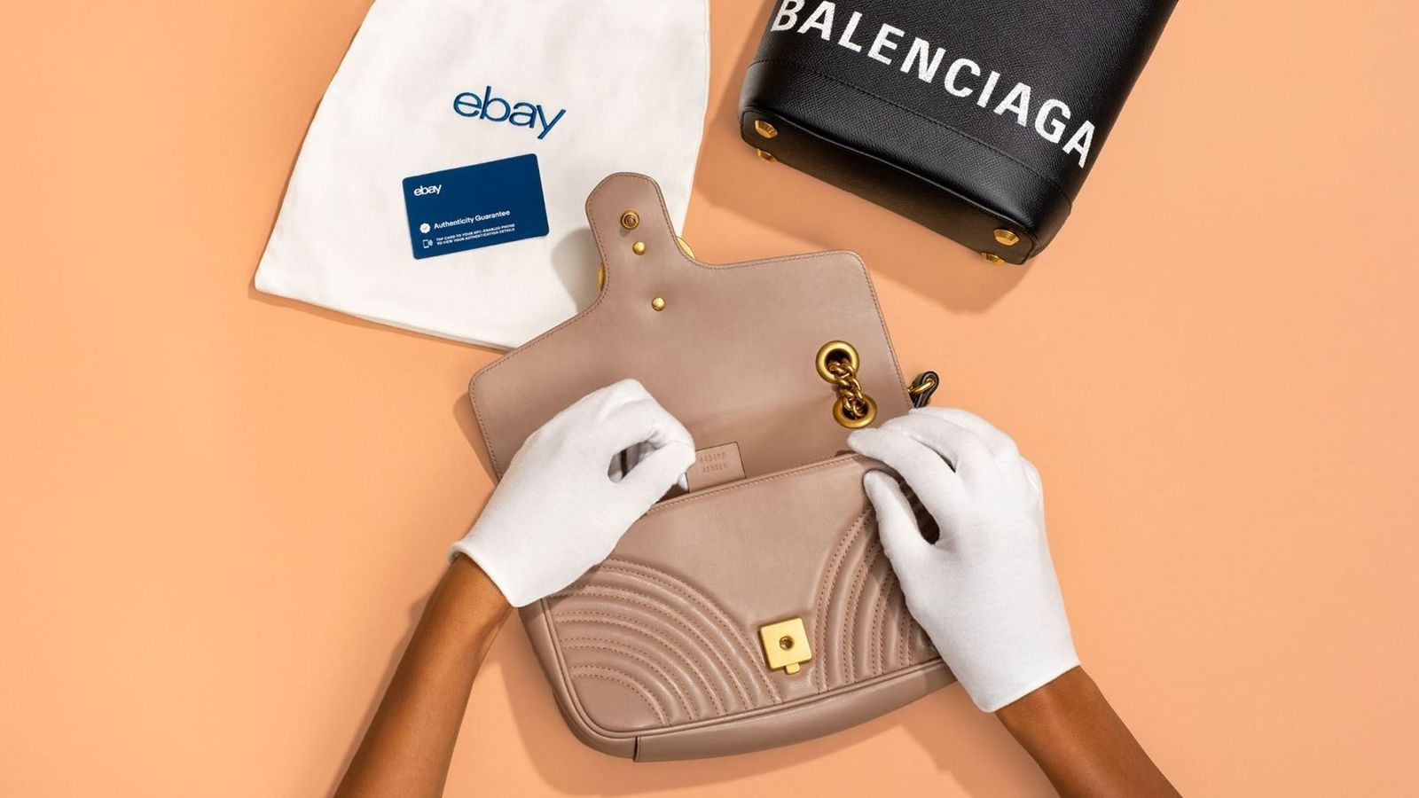 eBay Authenticity Guarantee program launch banner for luxury handbag authentication service