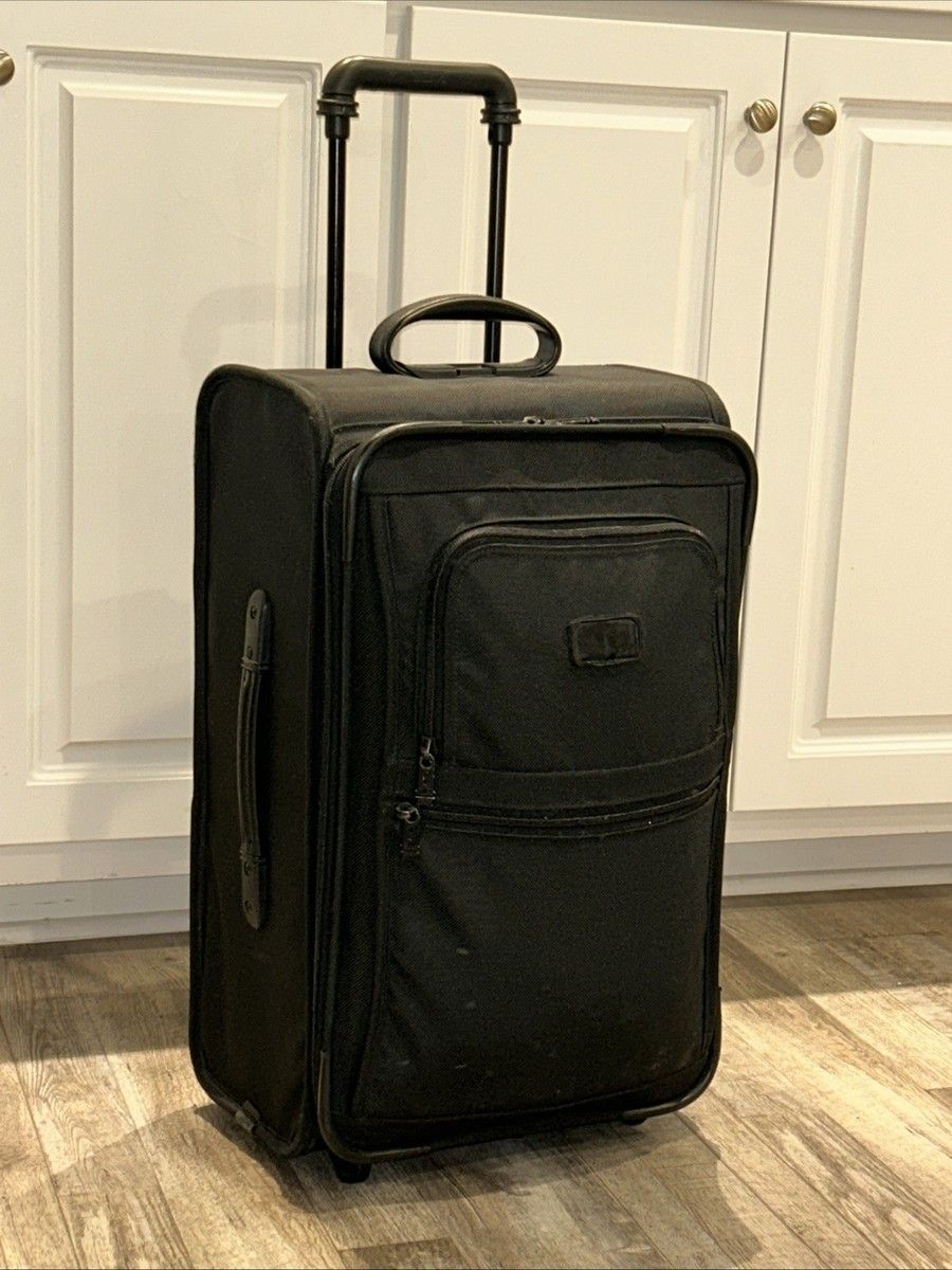 Tumi Alpha 22 inch black upright carry-on ballistic nylon suitcase for business travelers