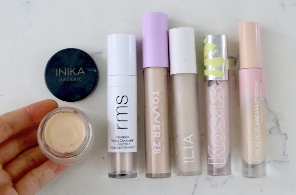Clean beauty concealer comparison swatches showing serum-like skincare-infused formulas