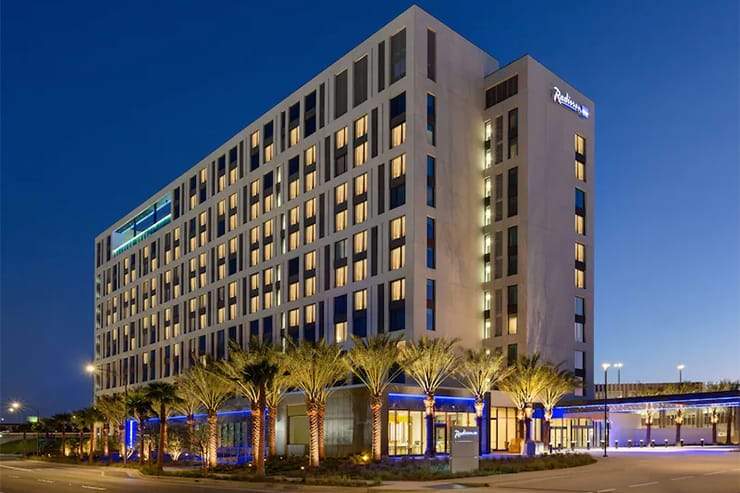 Radisson Blu luxury hotel exterior with modern glass facade at dusk in Anaheim California